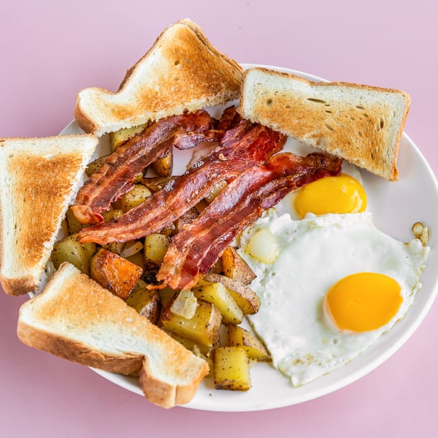 2 Eggs, Home Fries & Toast with Bacon.